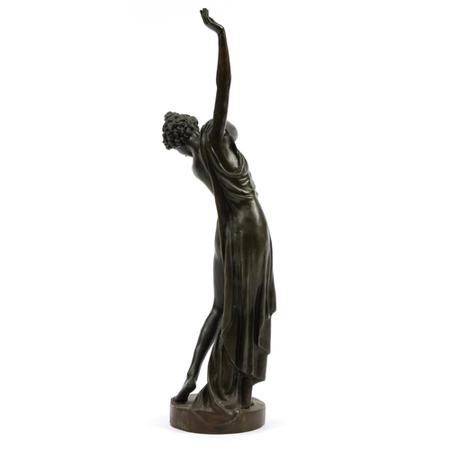 225 - Patinated bronze study of a semi nude Art Deco female dressing, 48cm high