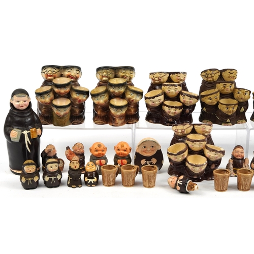 1442 - Collection of monk design decanters, egg cups and figures including Goebel,  the largest 22cm high