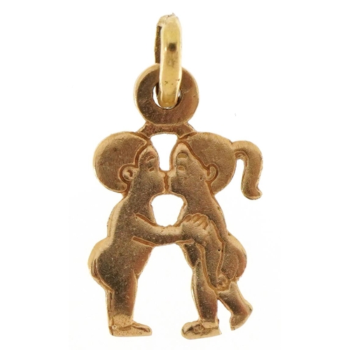 2583 - 14k gold boy and girl charm, 2.1cm high, 1.3g