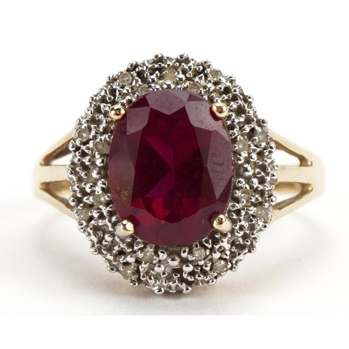 2085 - 9ct gold red stone and diamond three tier cluster ring with split shoulders, tests as ruby, the red ... 