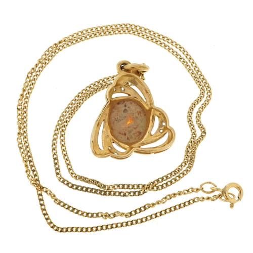 2114 - 9ct two tone gold cabochon orange stone pendant set with clear stones on a 9ct gold curb link neckla... 