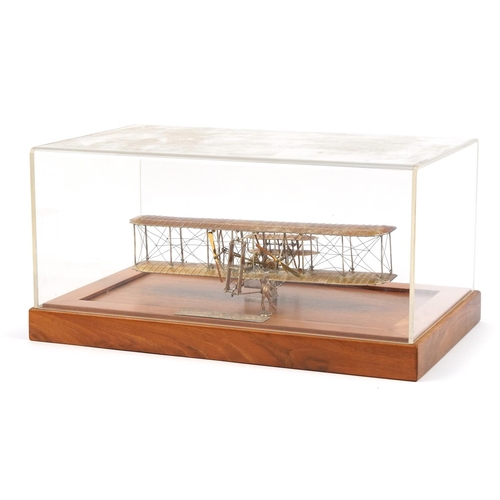 1810 - Sterling silver model of The Wright Brothers Flyer housed in a display case, the plaque engraved A L... 