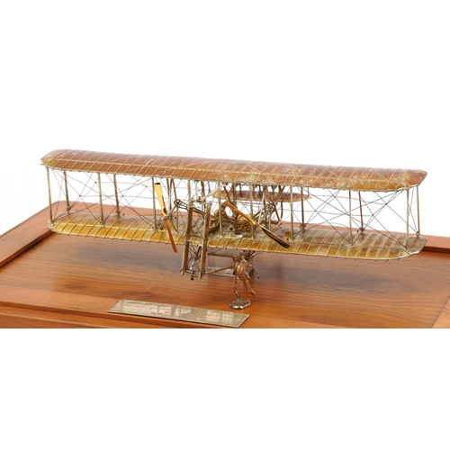 1810 - Sterling silver model of The Wright Brothers Flyer housed in a display case, the plaque engraved A L... 