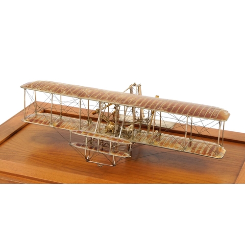 1810 - Sterling silver model of The Wright Brothers Flyer housed in a display case, the plaque engraved A L... 