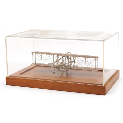 1810 - Sterling silver model of The Wright Brothers Flyer housed in a display case, the plaque engraved A L... 