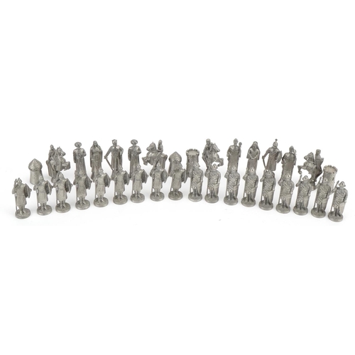 1406 - White metal medieval design chess set, the largest pieces 6.5cm high