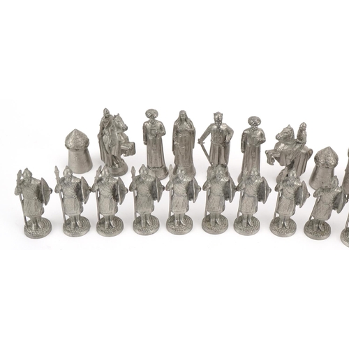 1406 - White metal medieval design chess set, the largest pieces 6.5cm high