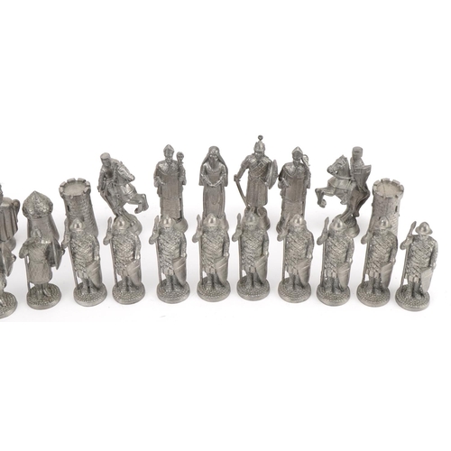 1406 - White metal medieval design chess set, the largest pieces 6.5cm high