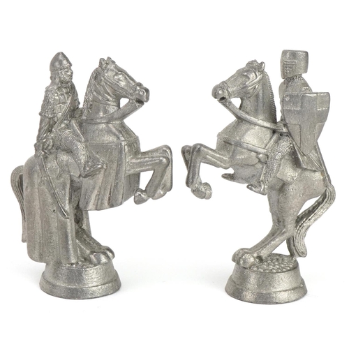 1406 - White metal medieval design chess set, the largest pieces 6.5cm high