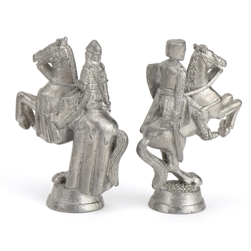 1406 - White metal medieval design chess set, the largest pieces 6.5cm high