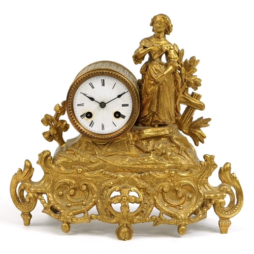 218 - French gilt metal striking mantle clock mounted with a female in a dress, the enamelled dial having ... 