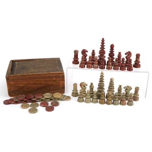 1404 - Chinese carved soapstone chess set and draughts pieces housed in a pine box, the largest pieces 10.5... 