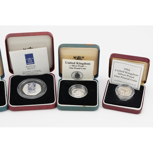 1885 - Six silver proof coins with fitted cases including D Day commemorative fifty pence coin and United K... 