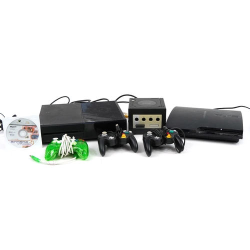 1440 - Three games consoles with controllers comprising Play Station 3, Nintendo Gamecube and Xbox