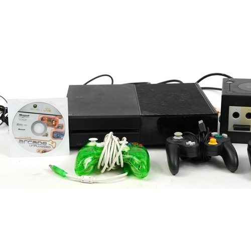 1440 - Three games consoles with controllers comprising Play Station 3, Nintendo Gamecube and Xbox