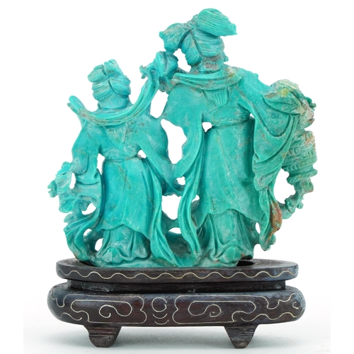 277 - Chinese turquoise carving of two females raised on a hardwood stand with white metal inlay, 11cm hig... 