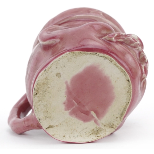 1784 - Military interest pink glazed mug in the form of a Bruce Bairnsfather's Old Bill, 11.5cm high