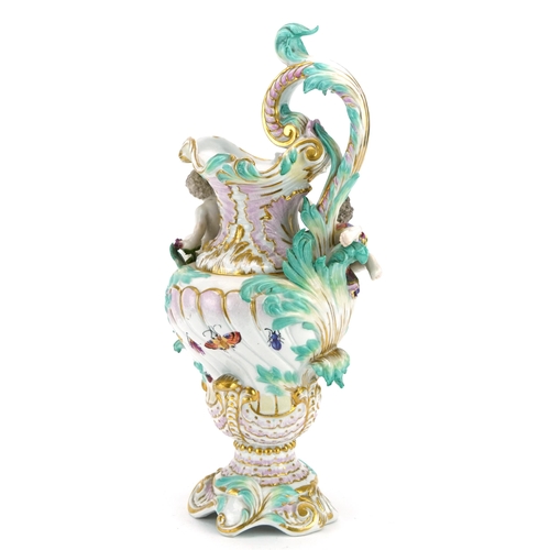 296 - Manner of Dresden, continental porcelain floral encrusted ewer surmounted with two Putti, inscribed ... 