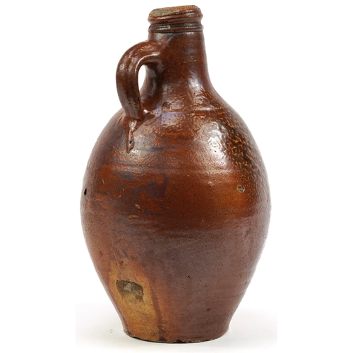 453 - Antique salt glazed Bellarmine jug, 29cm high