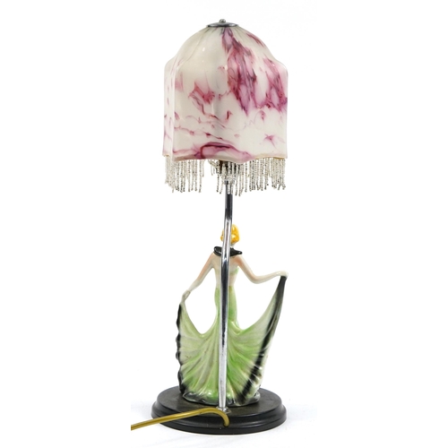 1279 - Art Deco porcelain female dancer table lamp with pink and white mottled glass shade, 48cm high