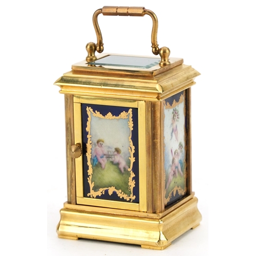 220 - Miniature brass carriage clock with Sevres type panels and Roman numerals, 8.5cm high