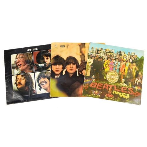 1720 - Three Beatles vinyl LP records including Sgt Pepper's Lonley Hearts Club Band with cut out and Beatl... 