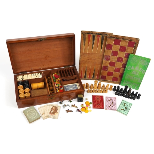 1402 - Victorian mahogany travelling games compendium to include various games including bone and ebony Dom... 