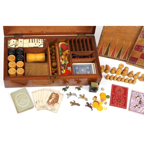 1402 - Victorian mahogany travelling games compendium to include various games including bone and ebony Dom... 