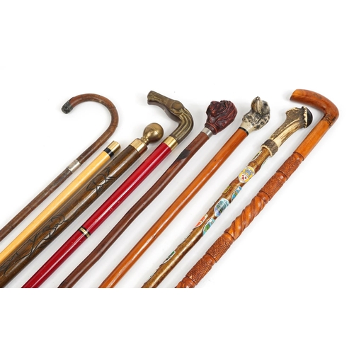 1678 - Seven walking sticks including a pool cue stick, one with horn handle and one bamboo with silver col... 