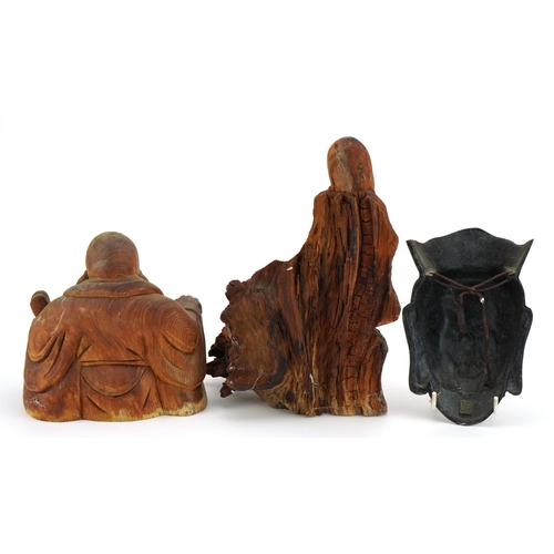 520 - Chino Tibetan patinated cast metal wall plaque in the form of Guanyin and two rootwood carvings, the... 