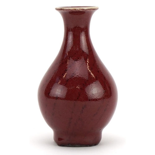 386 - Chinese porcelain vase having a sang de boeuf glaze, 12cm high