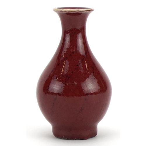 386 - Chinese porcelain vase having a sang de boeuf glaze, 12cm high