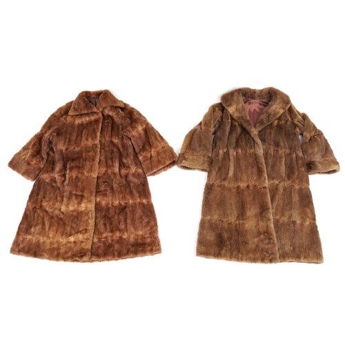 1396 - Two brown fur coats, each 110cm in length