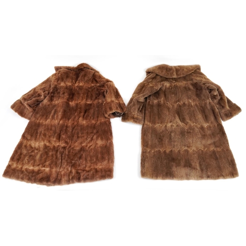 1396 - Two brown fur coats, each 110cm in length