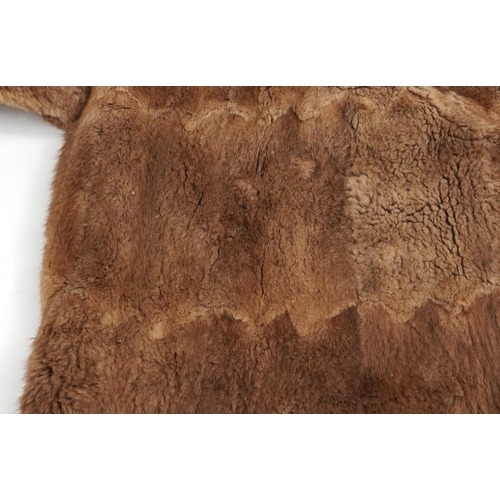 1396 - Two brown fur coats, each 110cm in length