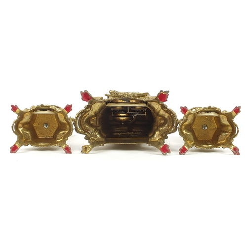 87 - French style gilt metal three piece striking clock garniture decorated with courting couples compris... 