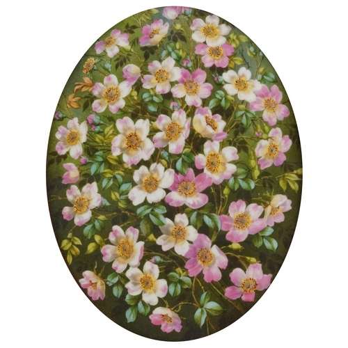 174 - Continental oval porcelain plaque hand painted with flowers housed in an ornate frame with velvet mo... 