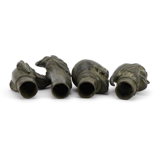 1476 - Four patinated bronze walking stick handles including skull, dog and parrot, the largest 12.5cm high