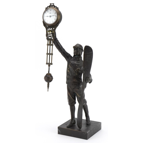 310 - Patinated bronze military interest mystery clock in the form of a pilot, 38cm high