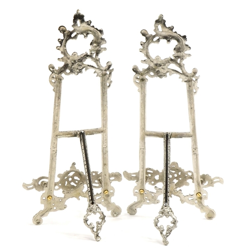 1283 - Pair of Rococo style silvered metal easel stands, each 41cm high