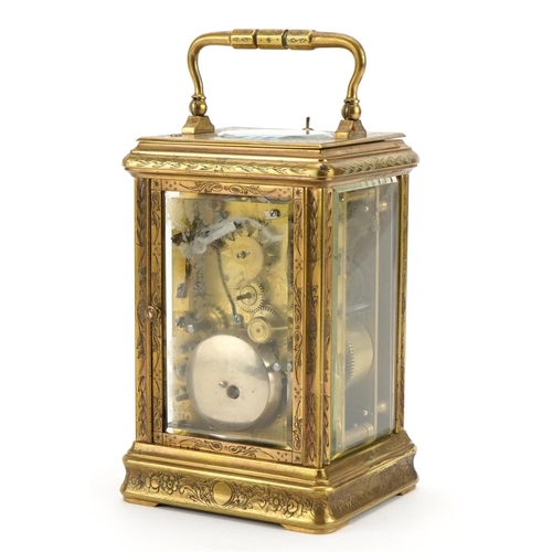 4 - Large brass cased repeating carriage alarm clock engraved with flowers, the enamelled dial with subs... 