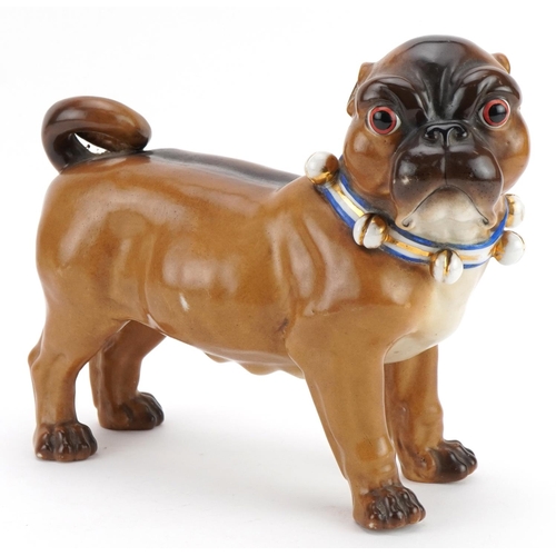 16 - 19th century continental porcelain model of a Pug dog, impressed marks and numbers to the feet, 24cm... 