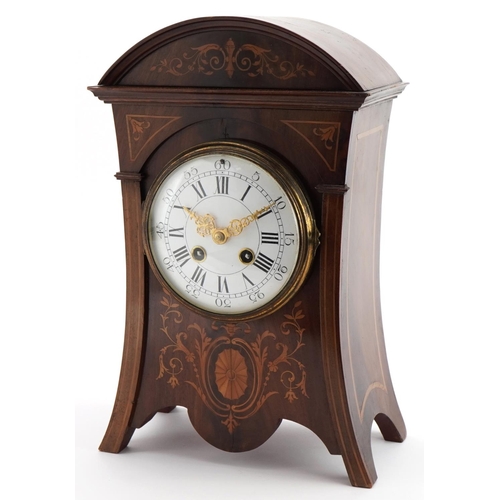 213 - 19th century inlaid mahogany mantle clock with enamelled dial, striking on a gong, having Roman and ... 