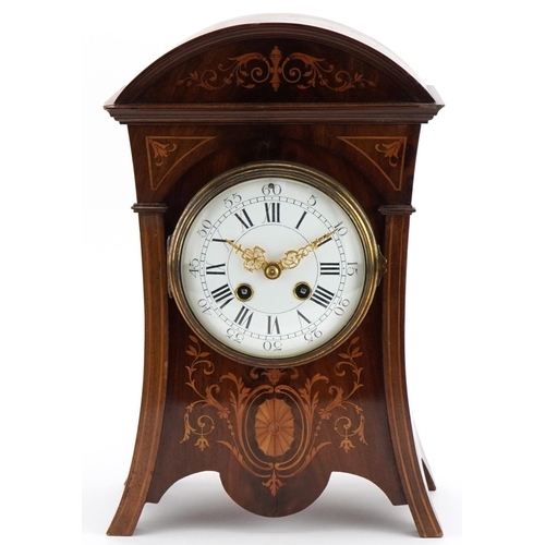 213 - 19th century inlaid mahogany mantle clock with enamelled dial, striking on a gong, having Roman and ... 