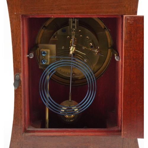 213 - 19th century inlaid mahogany mantle clock with enamelled dial, striking on a gong, having Roman and ... 