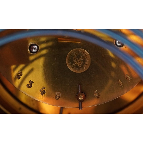 213 - 19th century inlaid mahogany mantle clock with enamelled dial, striking on a gong, having Roman and ... 