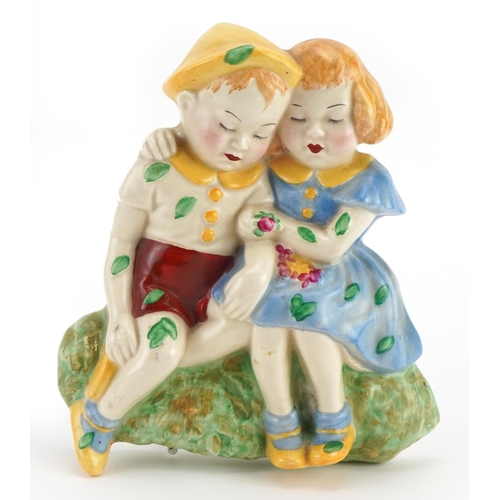 320 - Crown Devon, Art Deco pottery wall plaque of two children, 16cm high