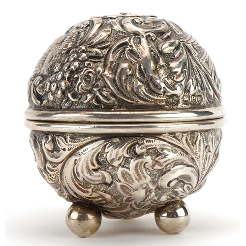 1814 - William Comyns, Victorian silver string box embossed with birds amongst foliage raised on three ball... 