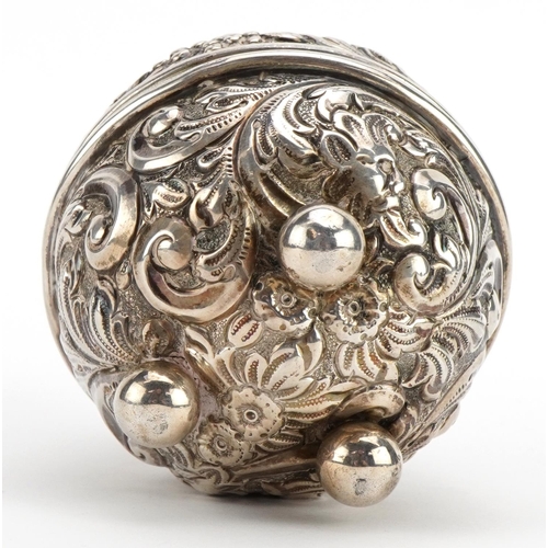 1814 - William Comyns, Victorian silver string box embossed with birds amongst foliage raised on three ball... 