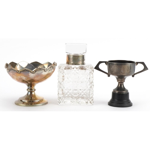 1849 - Silver objects comprising a pedestal bonbon dish, miniature twin handled trophy and cut glass scent ... 